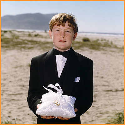 ring bearer at beach wedding, Oregon, USA